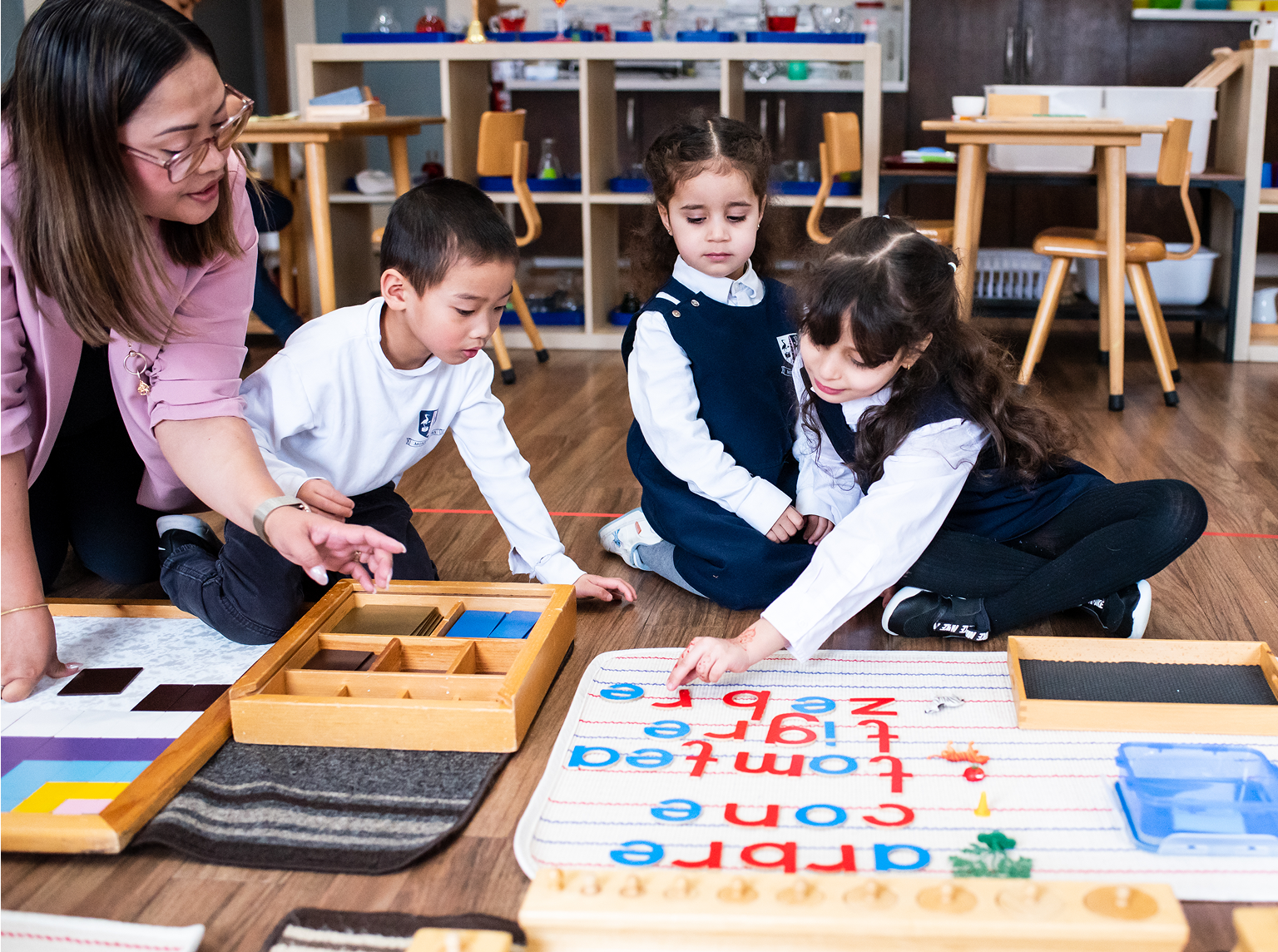 Teacher guiding children.