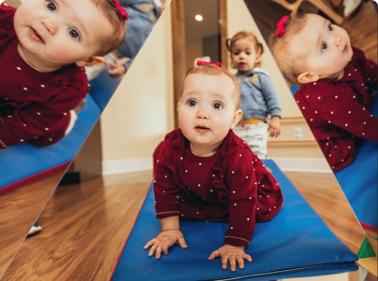 Babies crawling and standing on play mat.